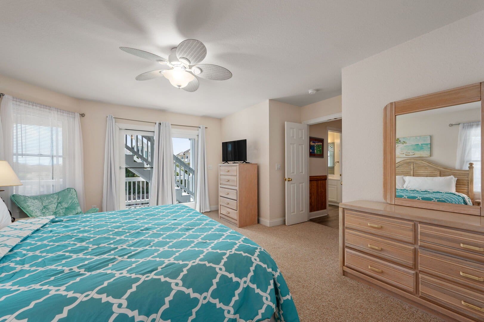 Cozy bedroom with teal bedding.