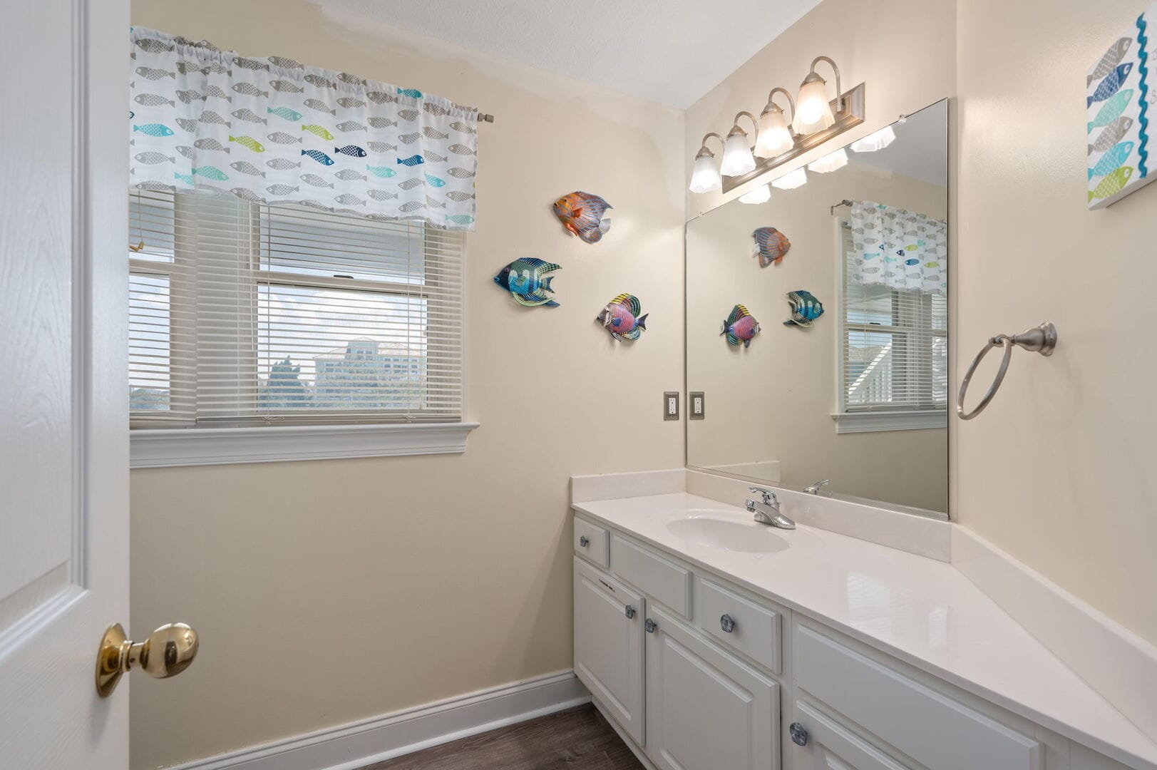 Bathroom with fish-themed decor.