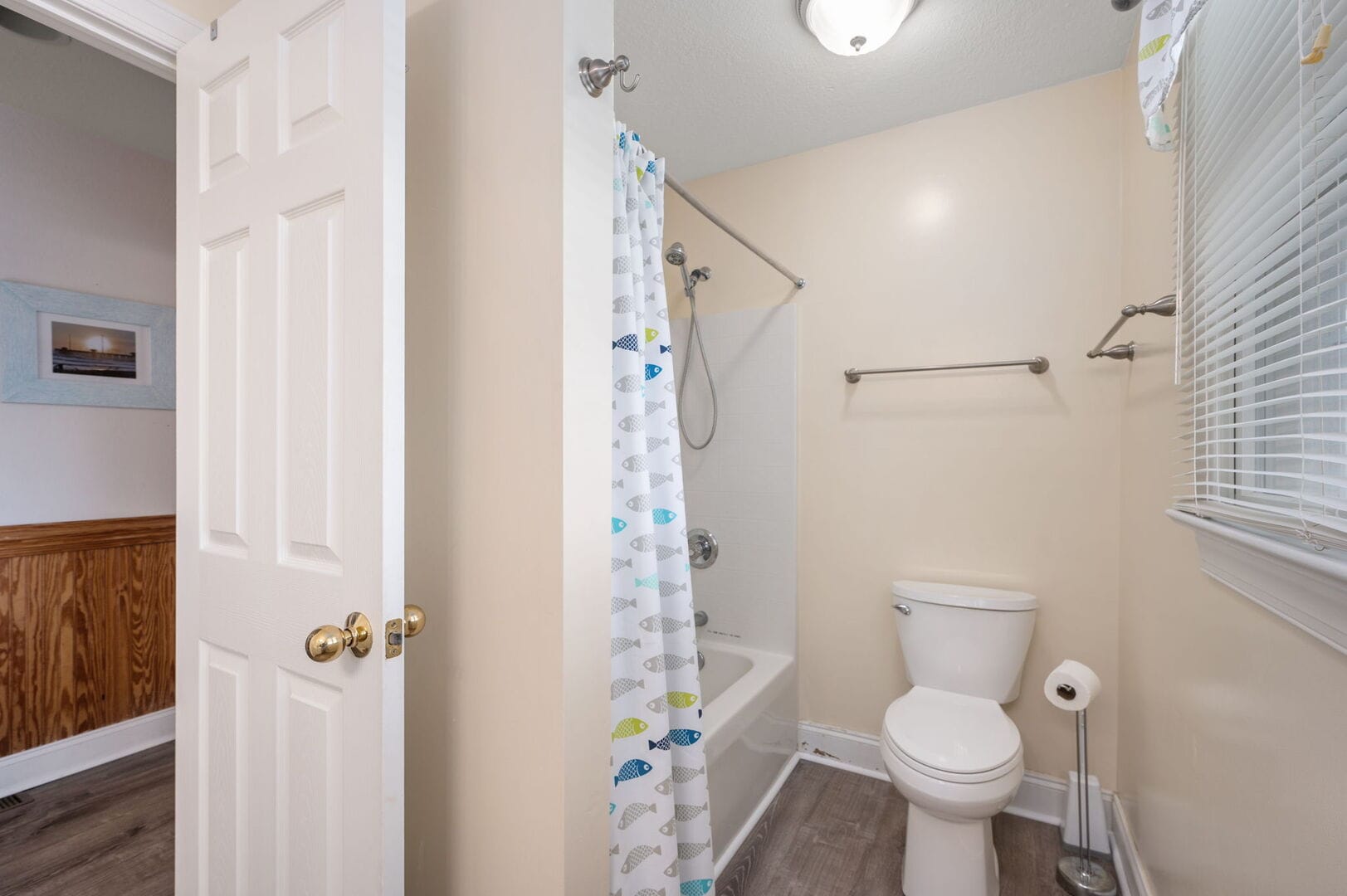 Small bathroom with shower curtain.