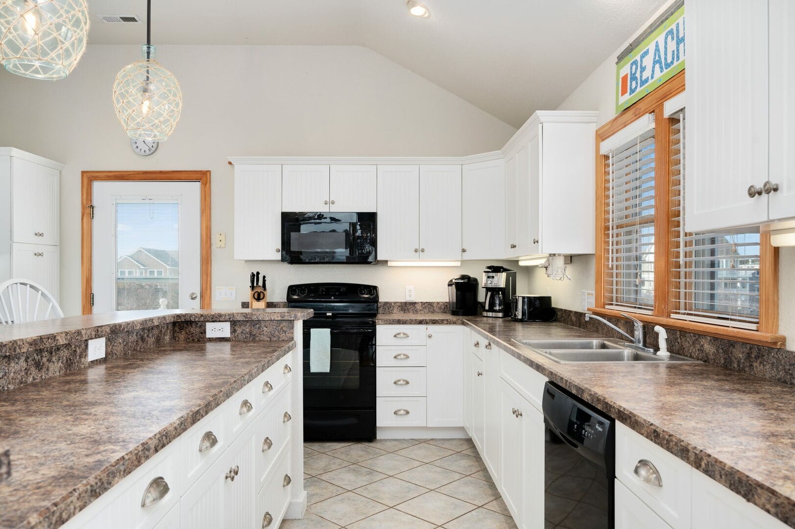 Bright kitchen with white cabinets.