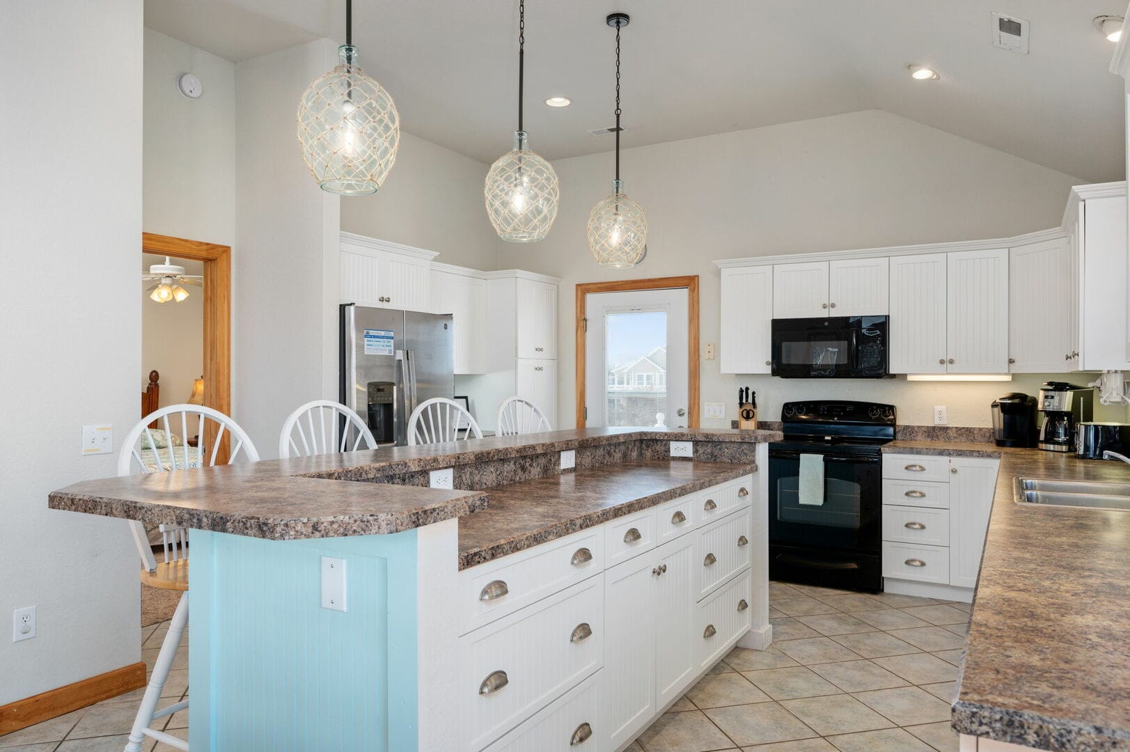 Spacious kitchen with island counter.