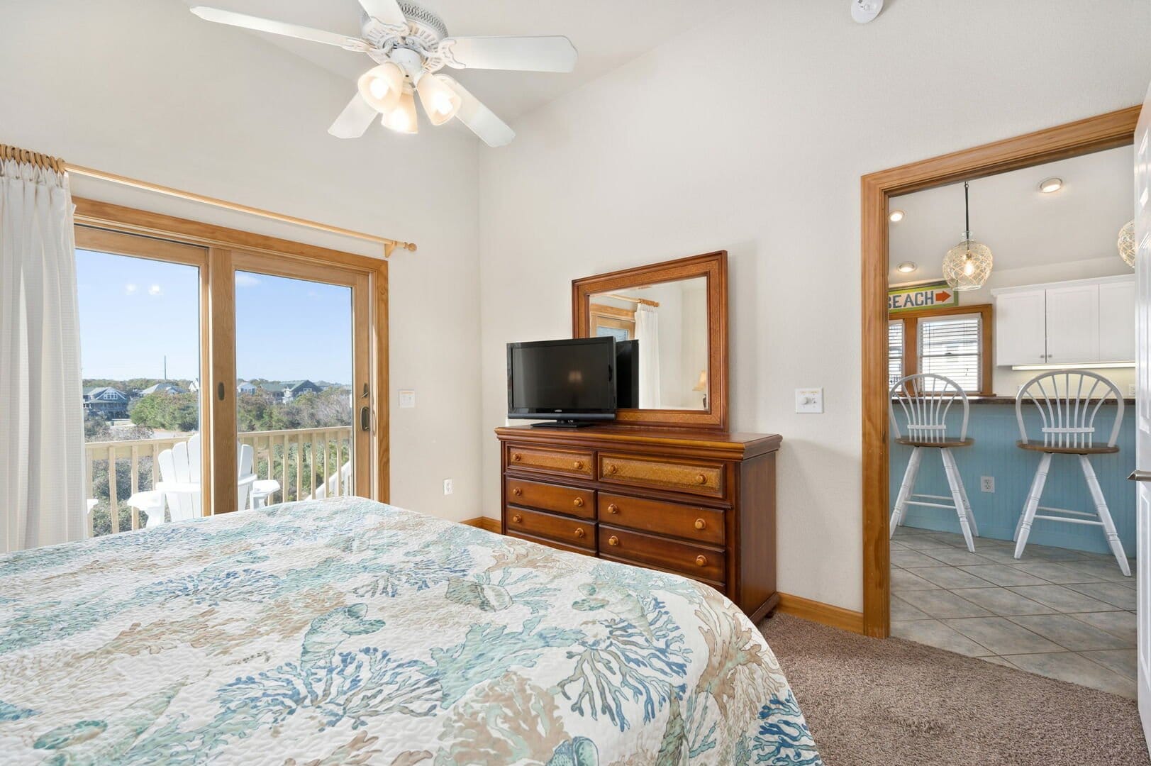 Bedroom with TV and ocean view.