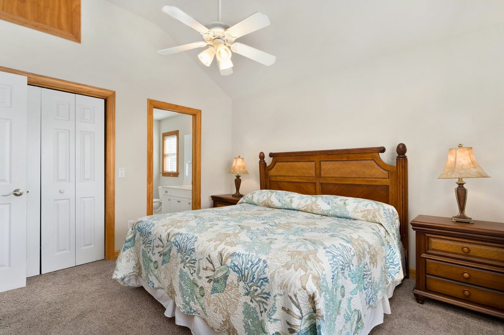 Cozy bedroom with floral bedding.