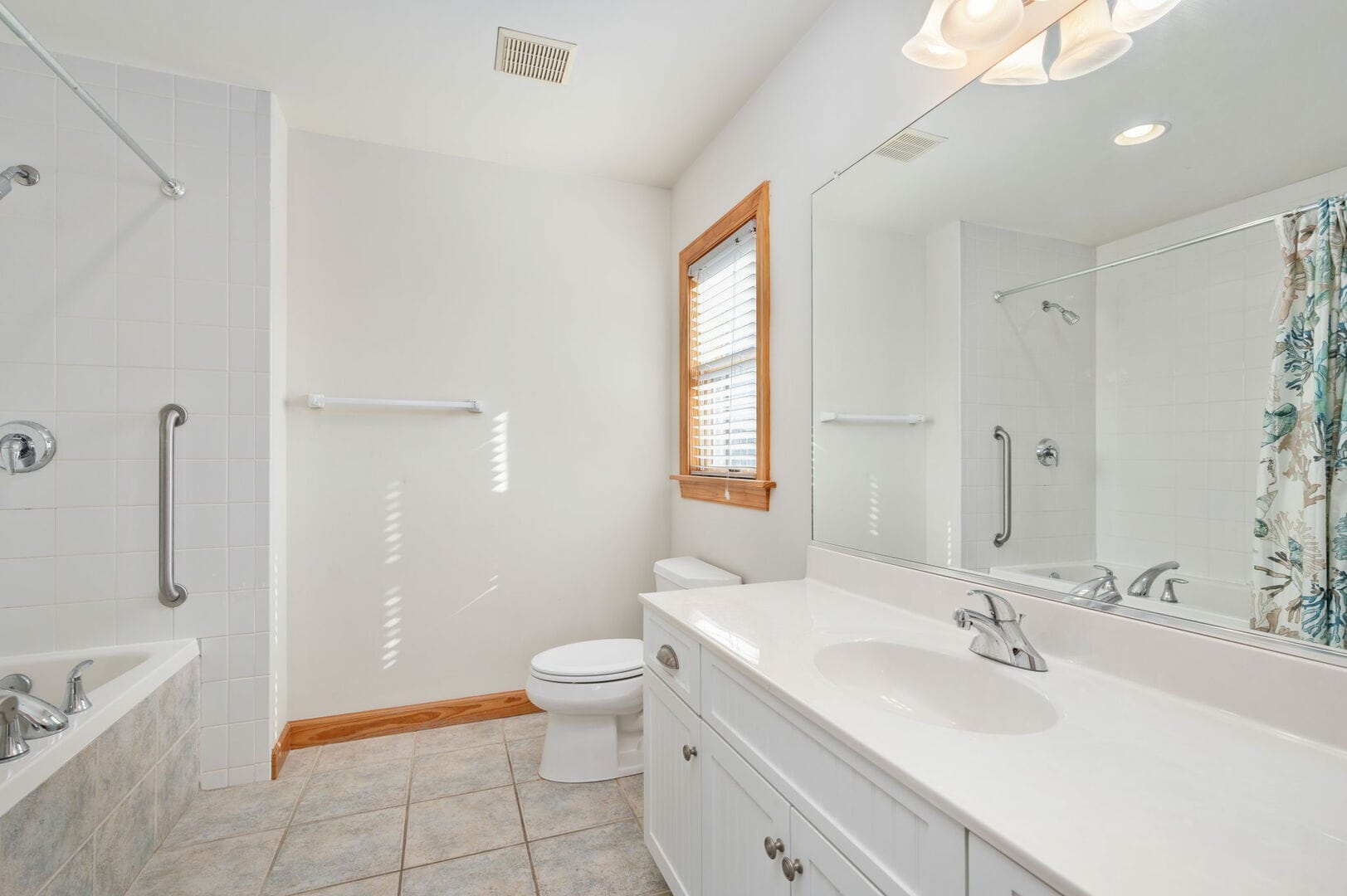 Bright bathroom with tub and sink.