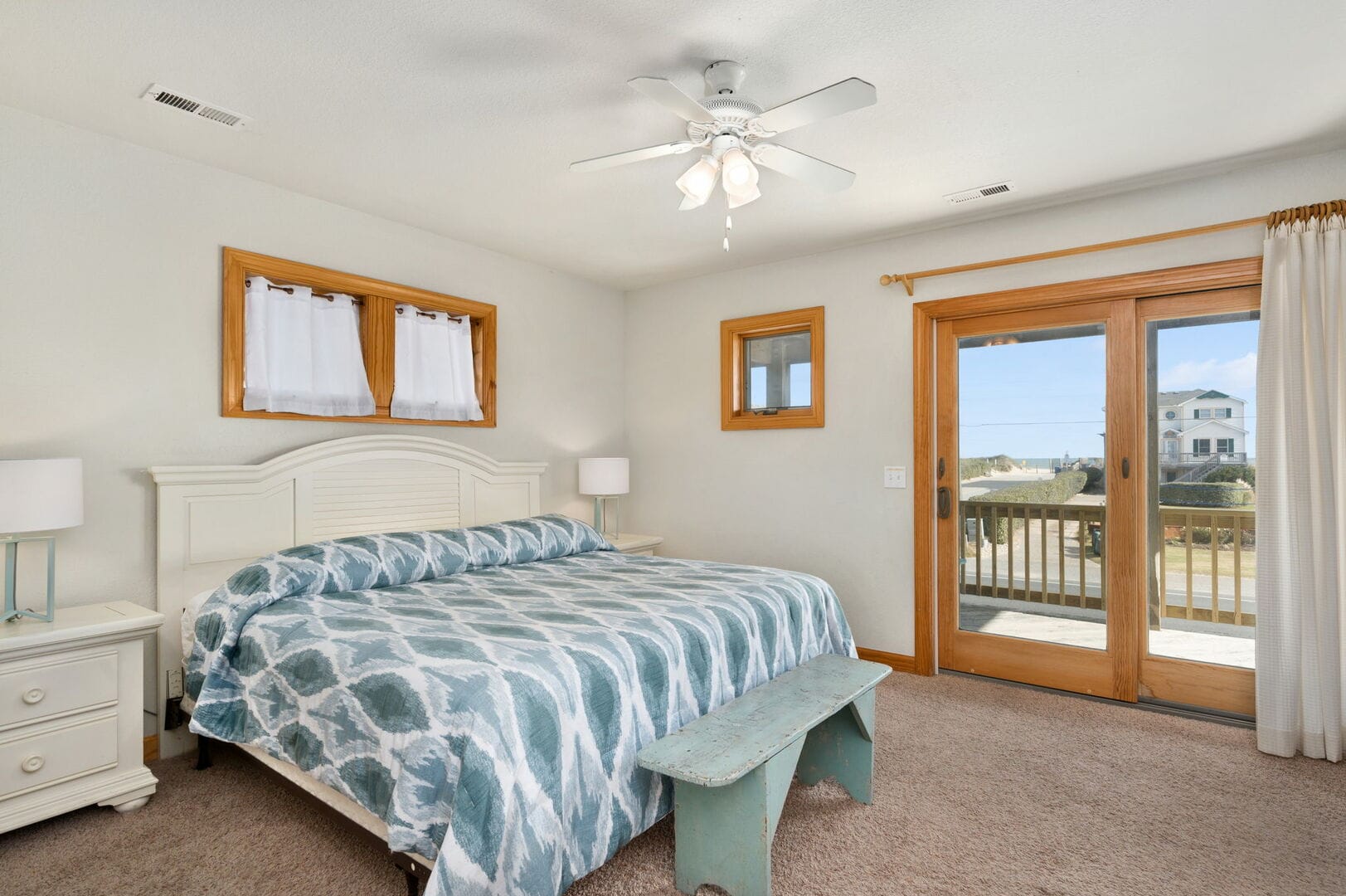 Bedroom with king bed, balcony.