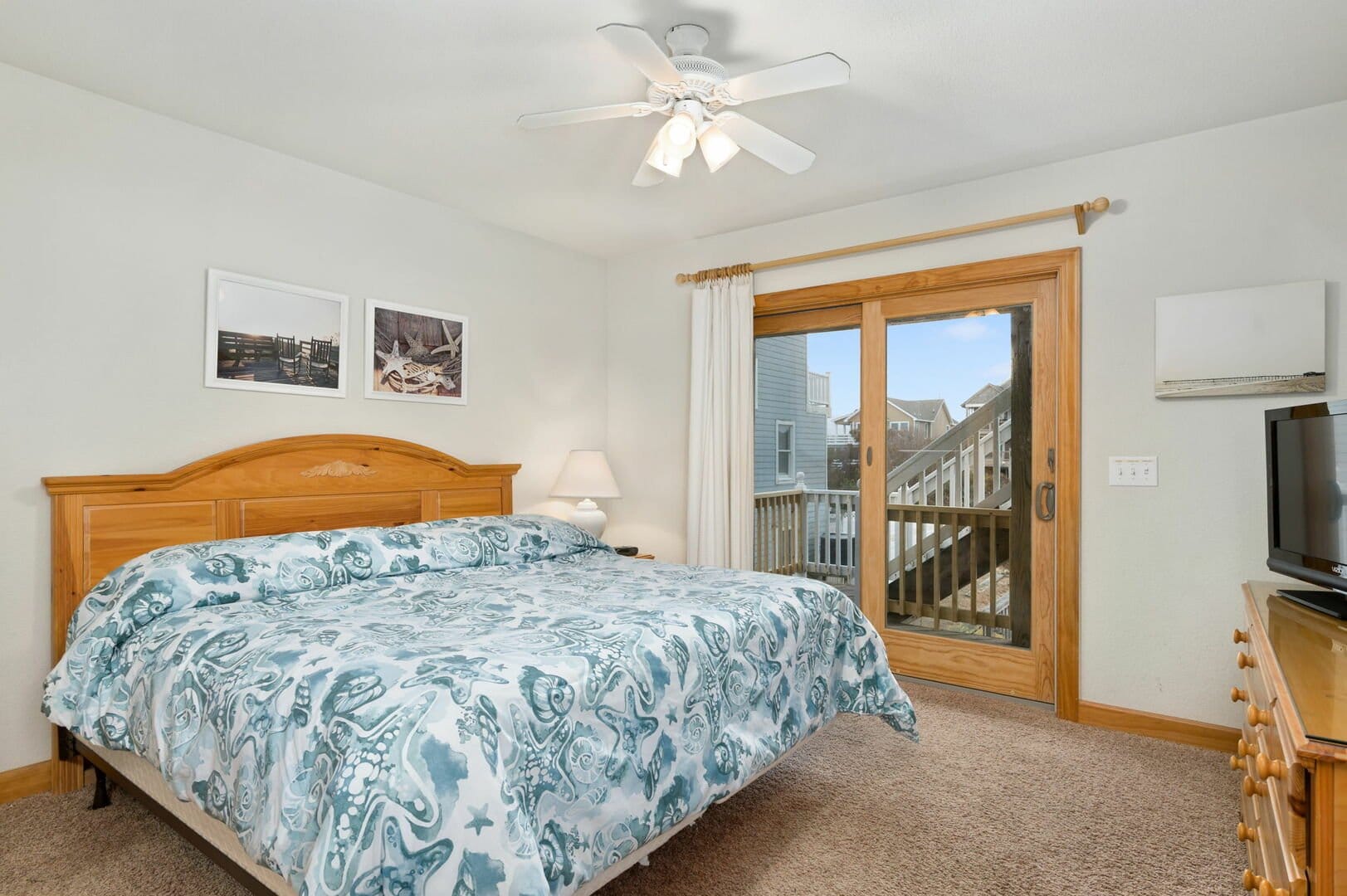 Bedroom with bed and sliding doors.
