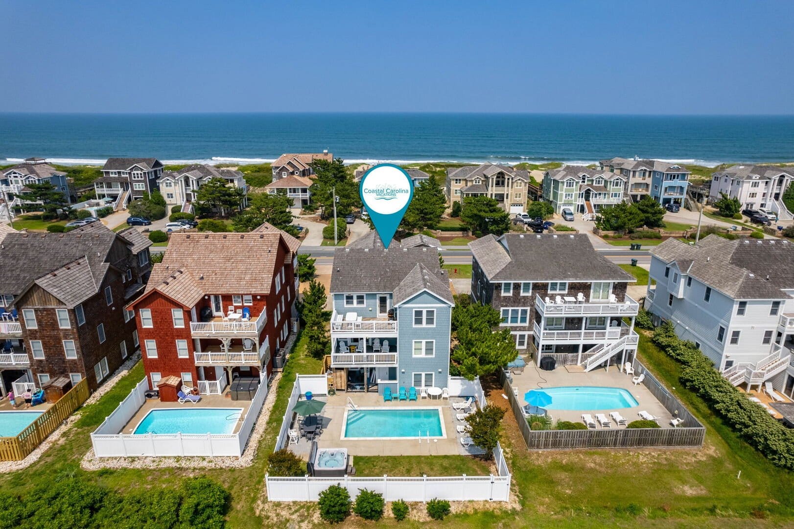 Beachfront houses with swimming pools.