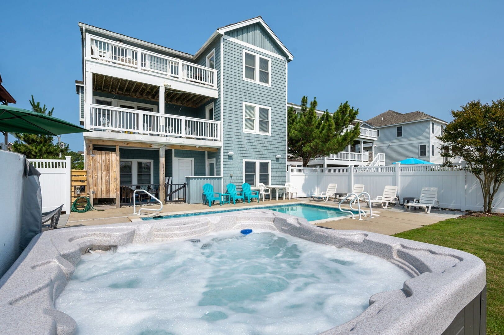 House with pool and hot tub.