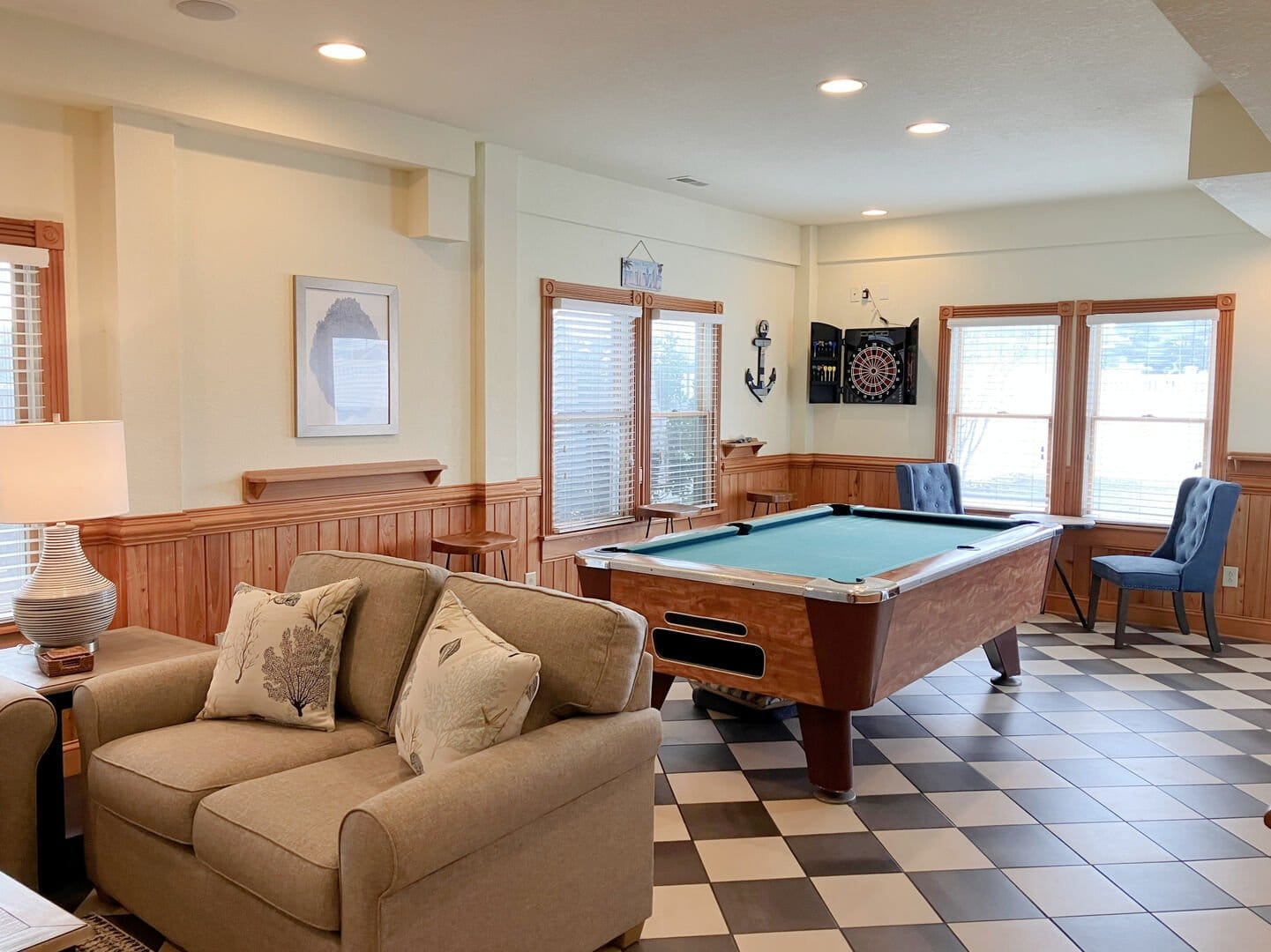 Room with pool table, sofa.