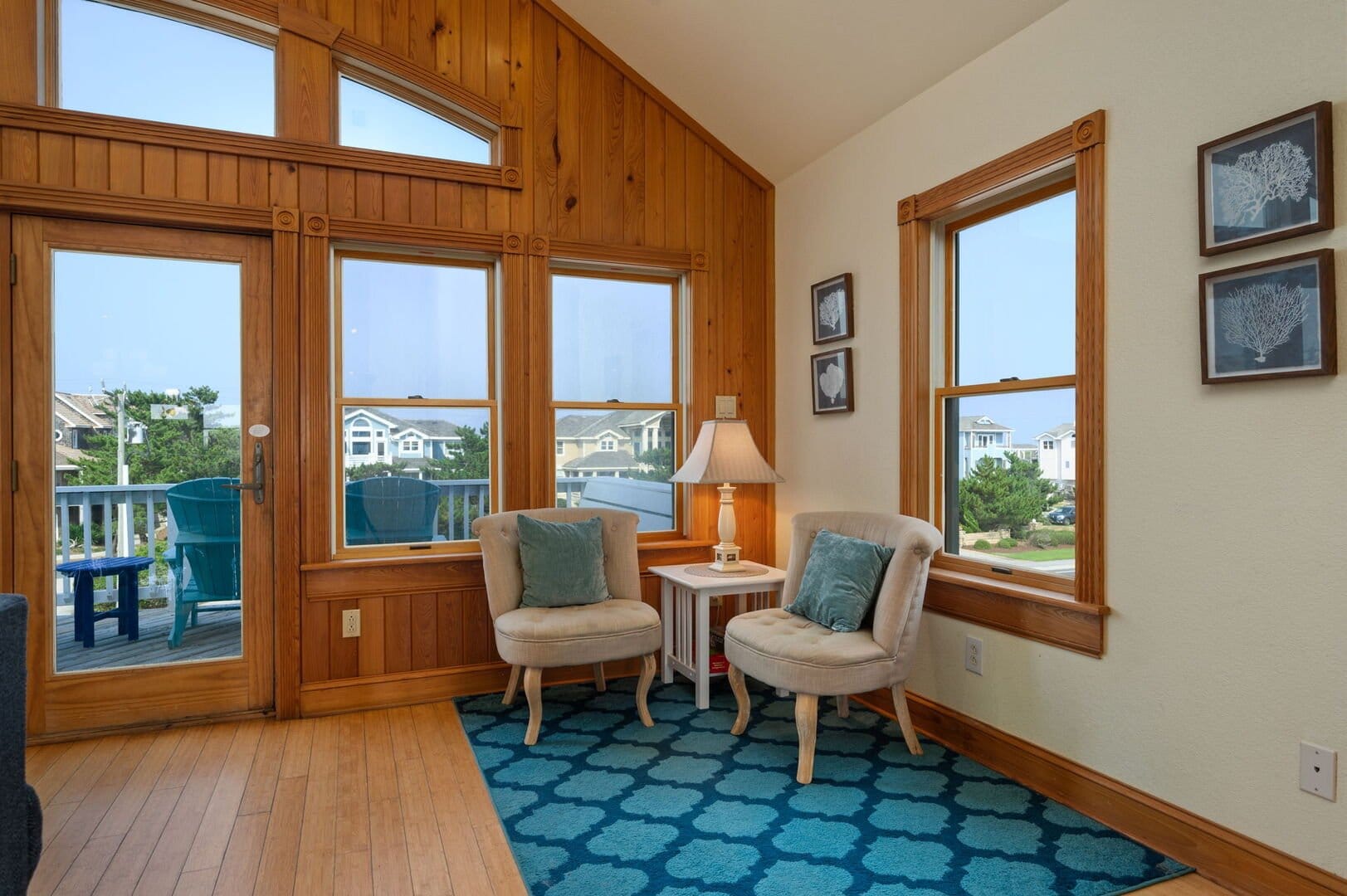 Sunny room with chairs and windows.