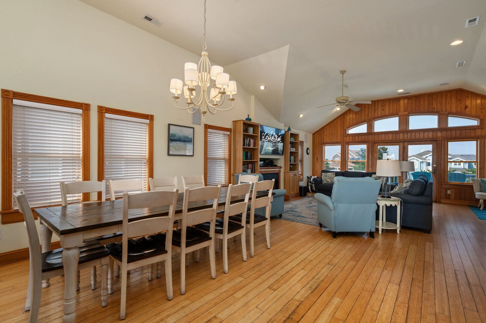 Spacious living-dining area with windows.