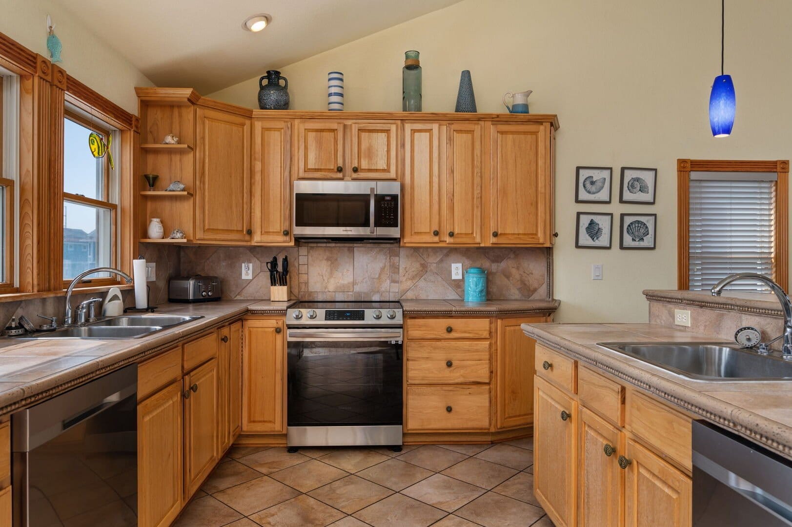 Spacious kitchen with wooden cabinets.