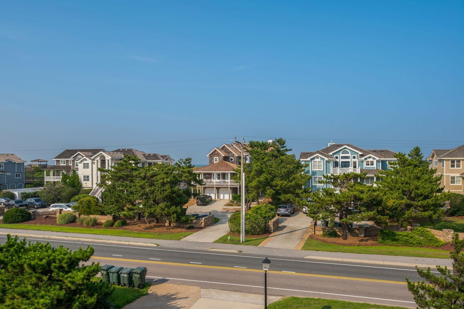 Coastal homes along the street.
