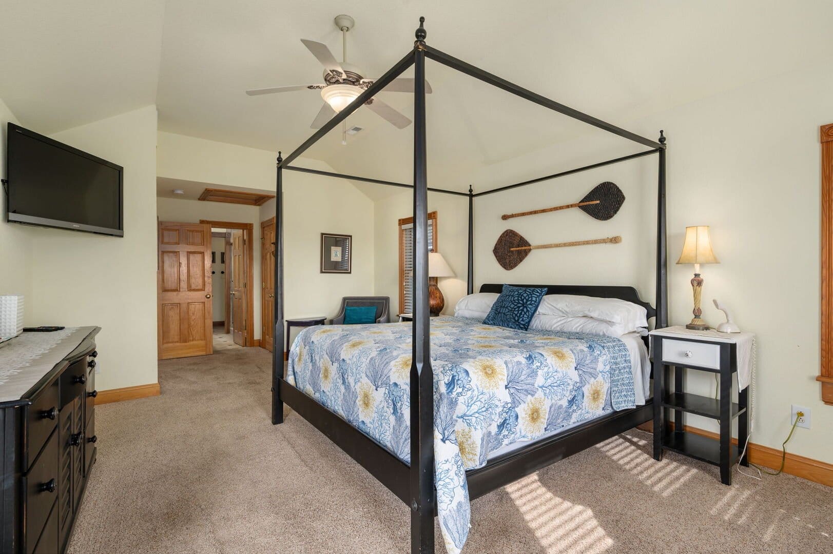 Bedroom with canopy bed and decor.