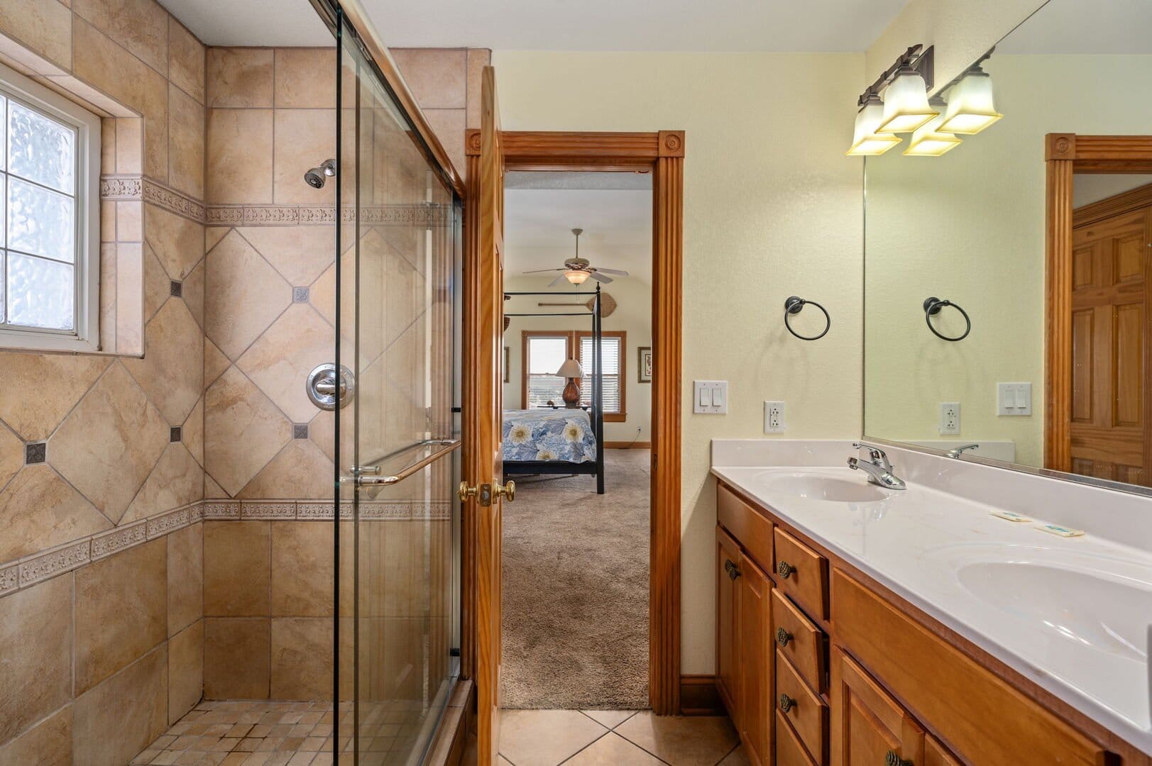 Bathroom leading to a bedroom.