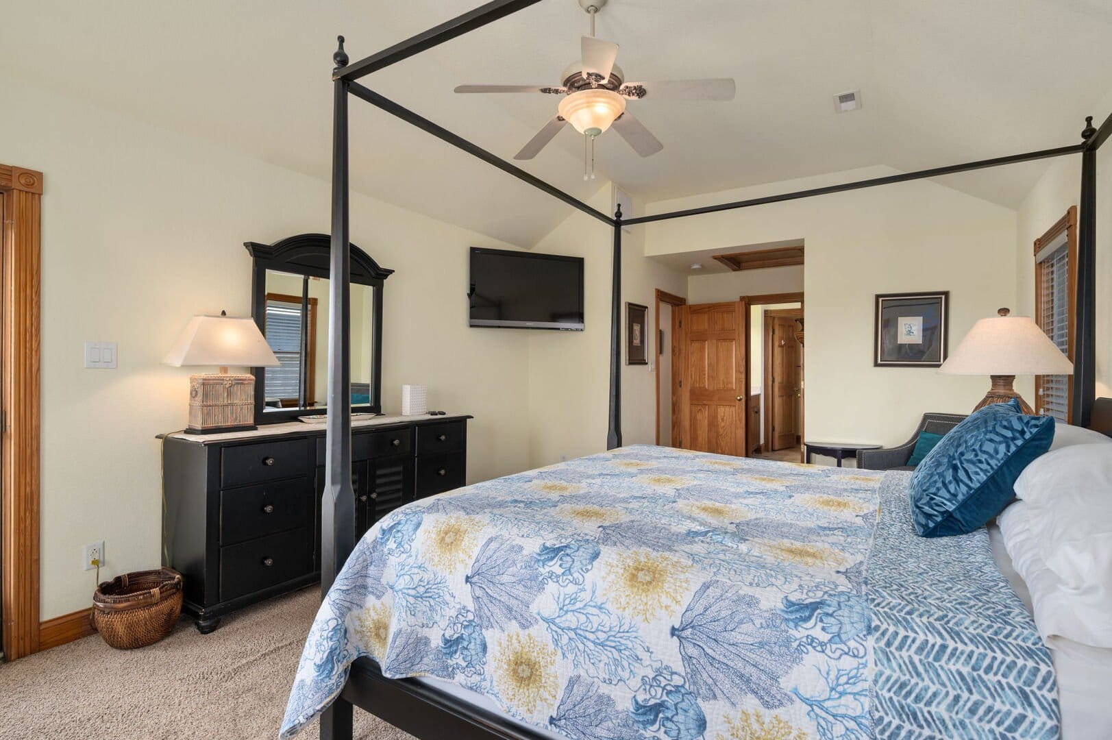 Elegant bedroom with four-poster bed.