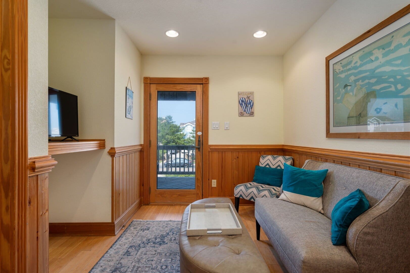Cozy living room with balcony view.