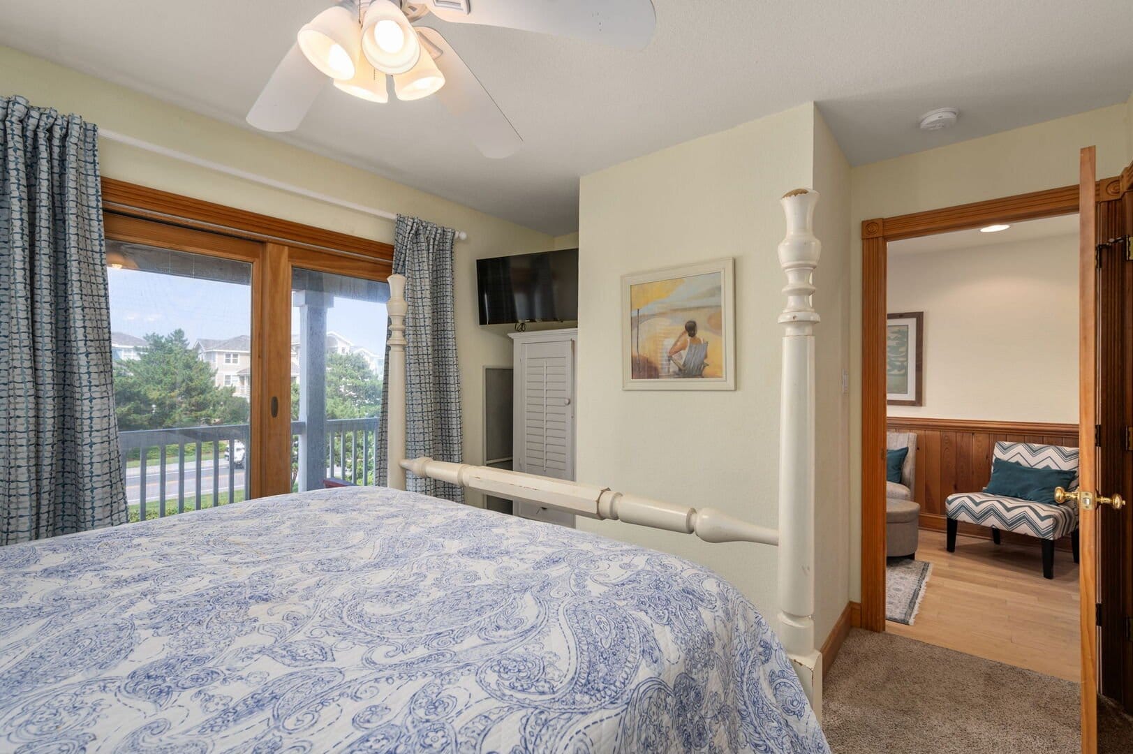 Cozy bedroom with balcony view.