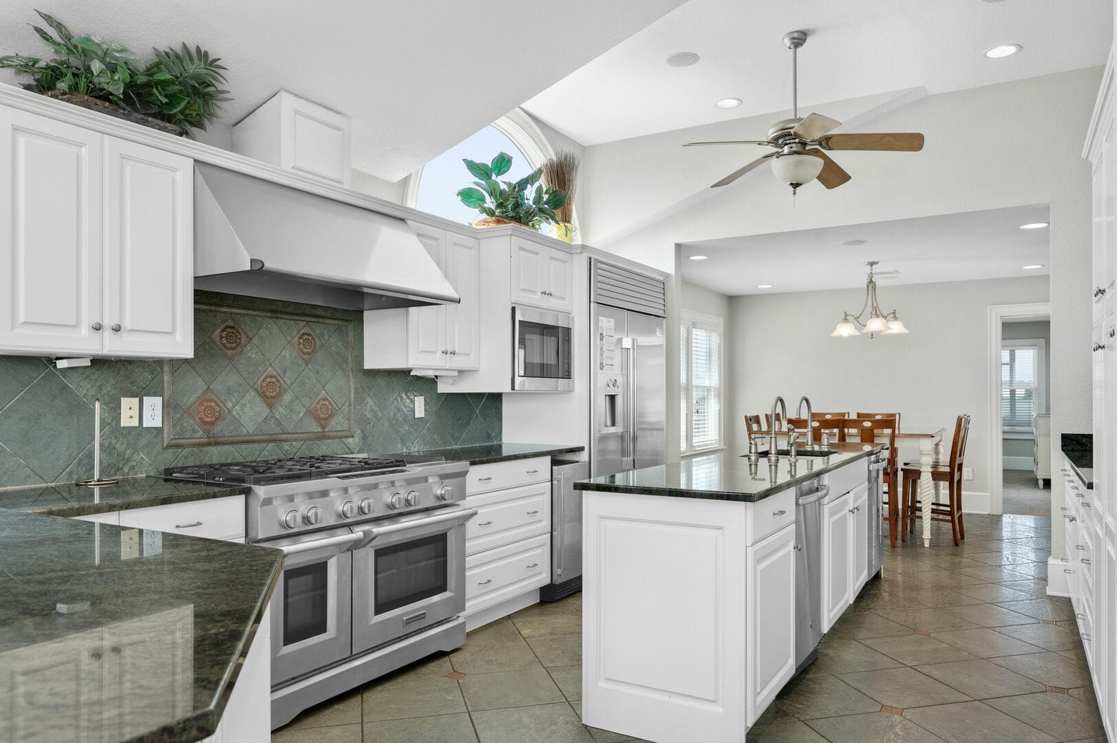 Modern kitchen with island and dining.