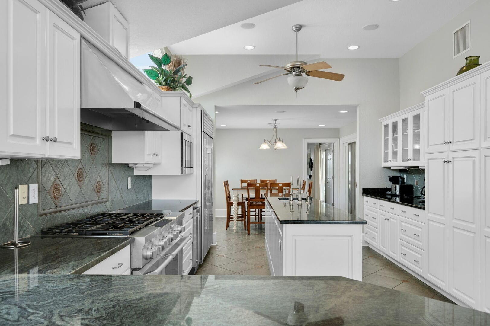 Modern kitchen with white cabinets.