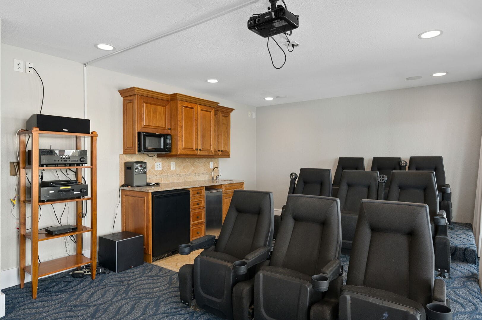 Home theater with recliner seats.
