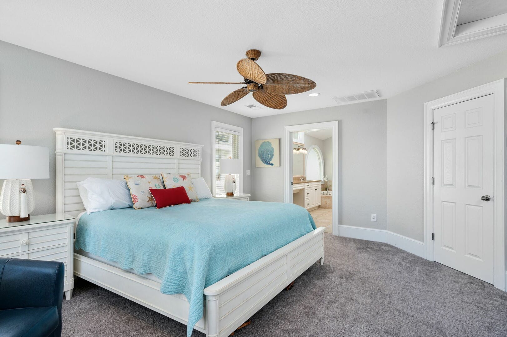 Coastal bedroom with blue bedding.