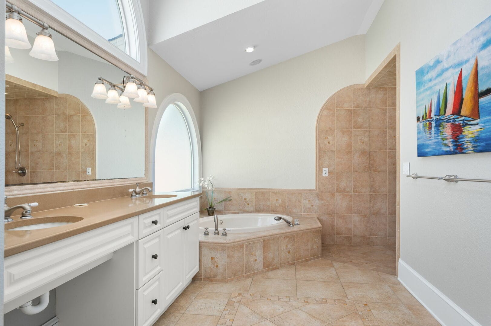 Bright bathroom with bathtub and sink.