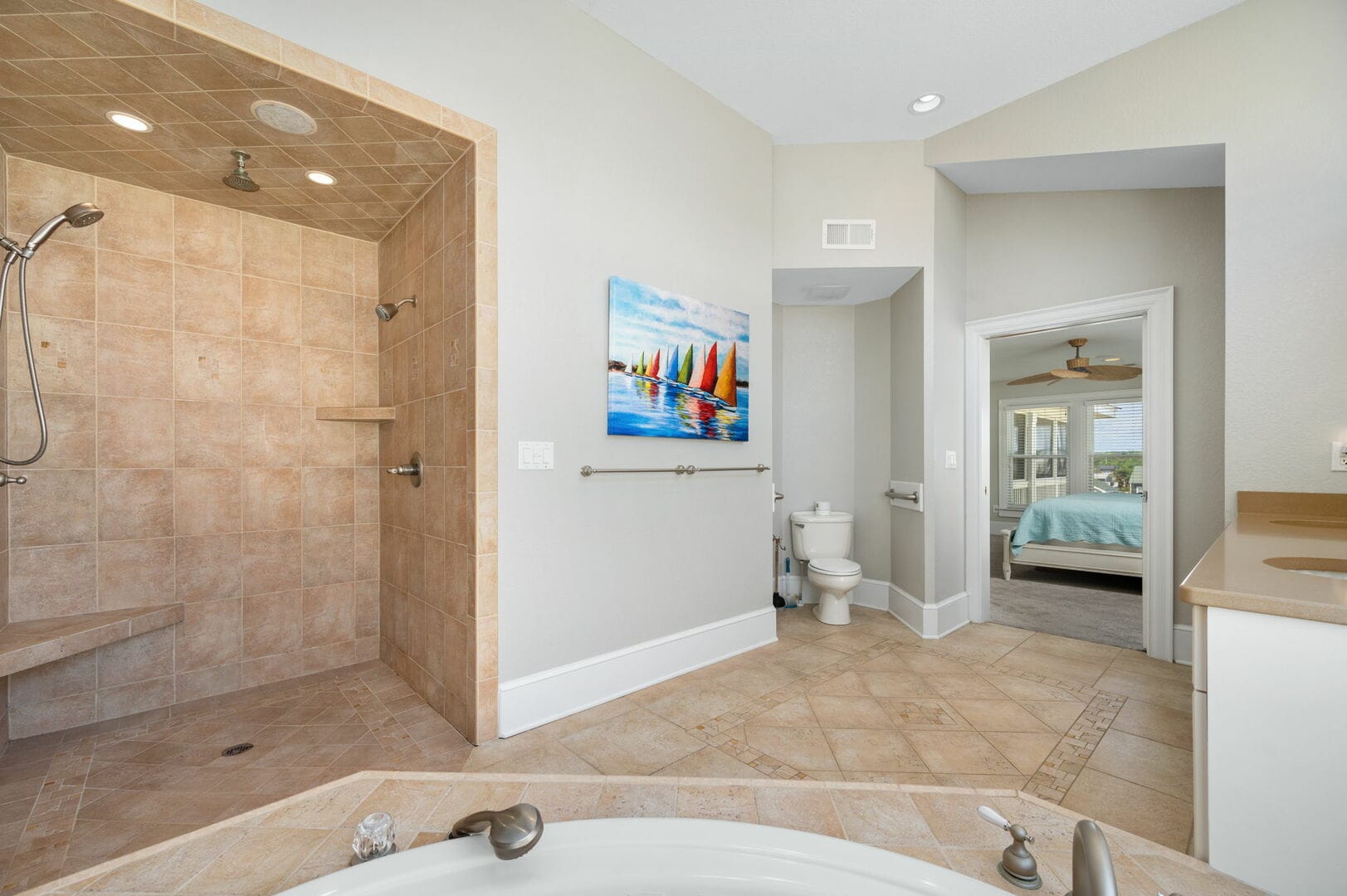 Spacious bathroom with open shower.