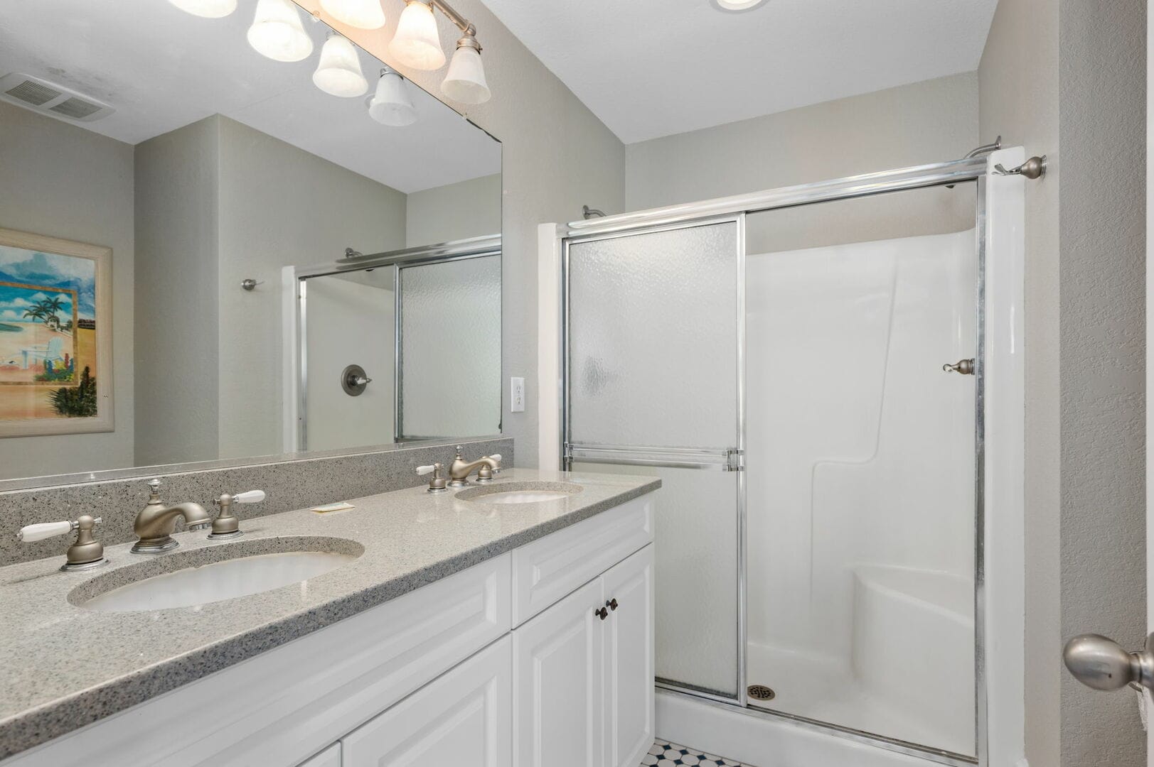 Modern bathroom with dual sinks.