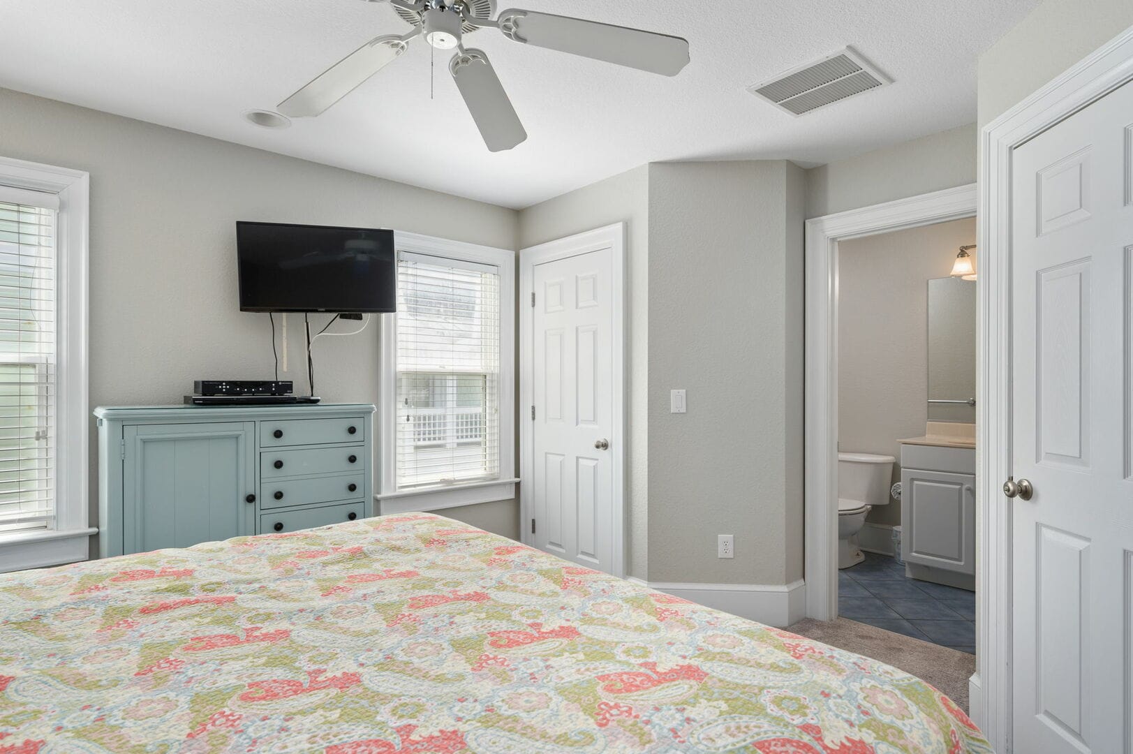 Bedroom with TV and ensuite bathroom.