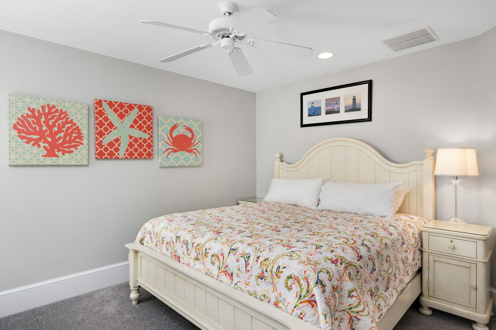 Beach-themed bedroom with decorative art.
