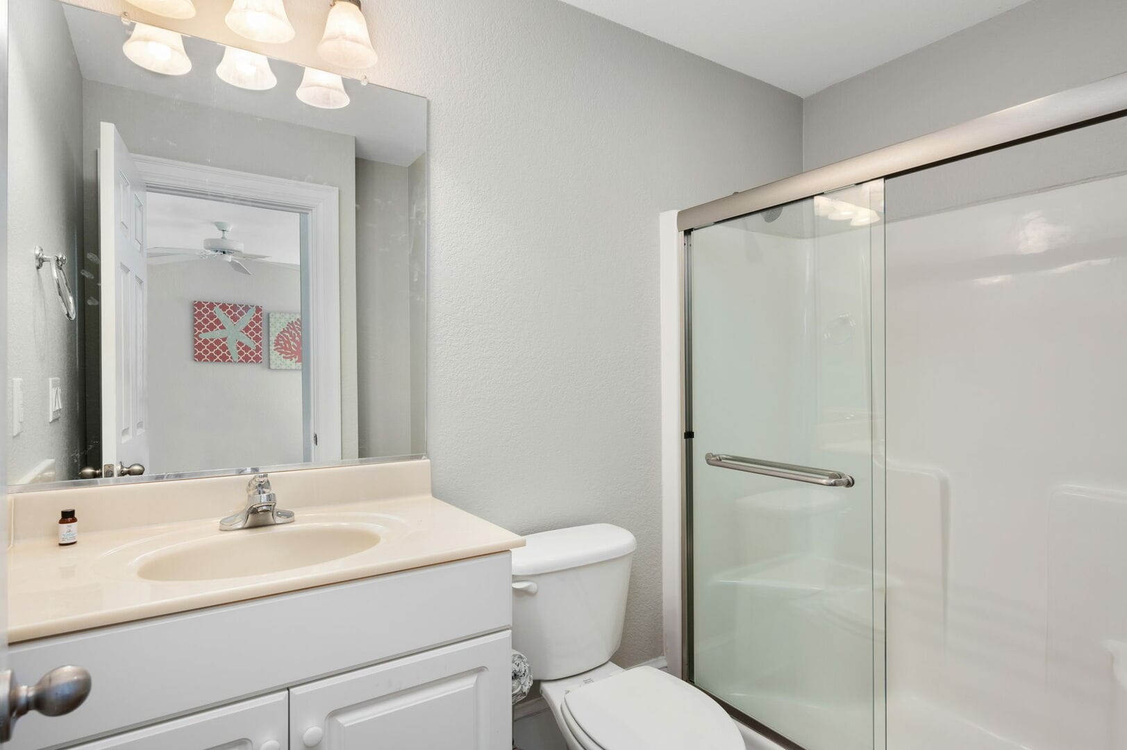 Modern bathroom with shower, vanity.