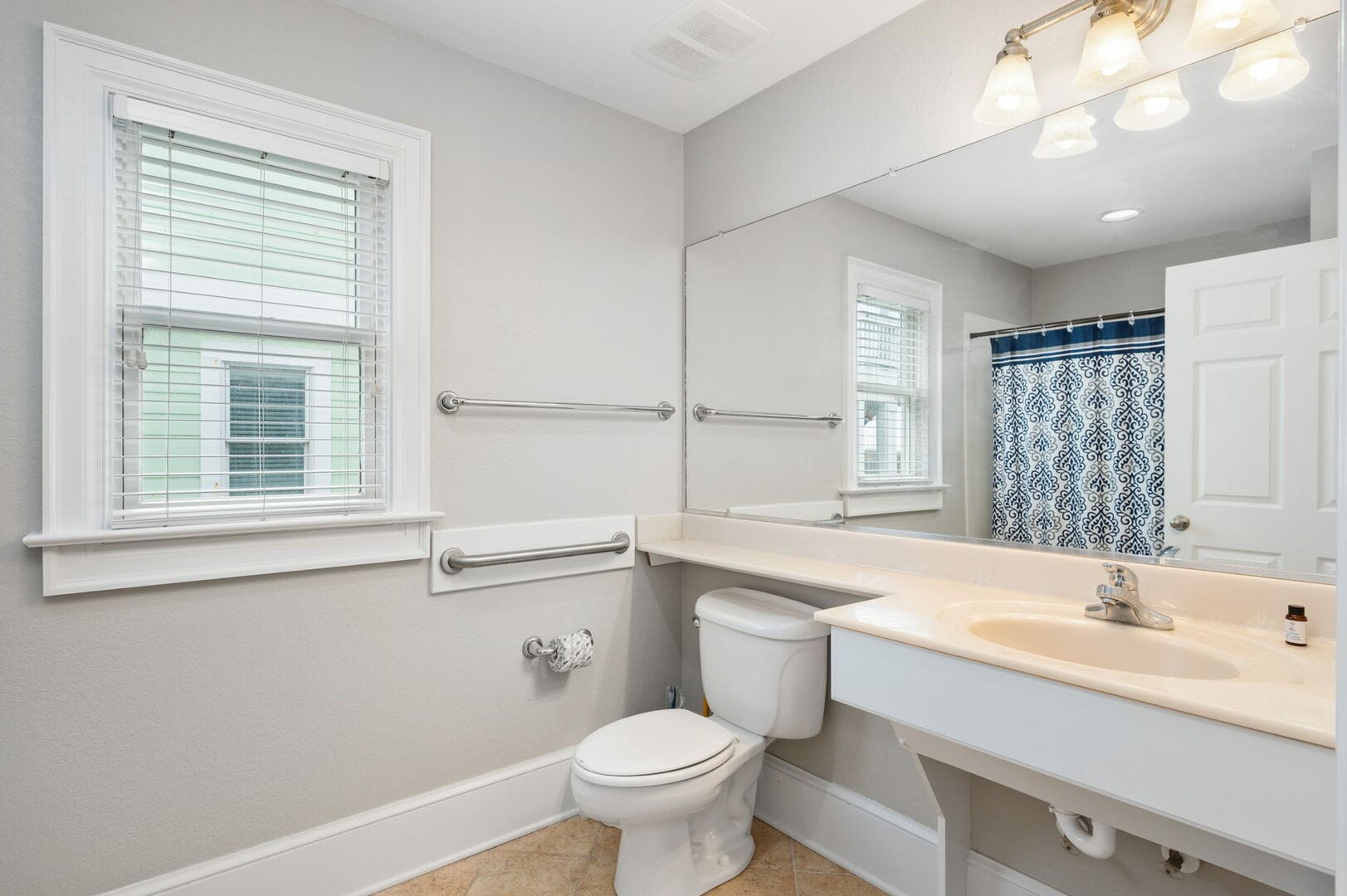 Clean bathroom with shower curtain.