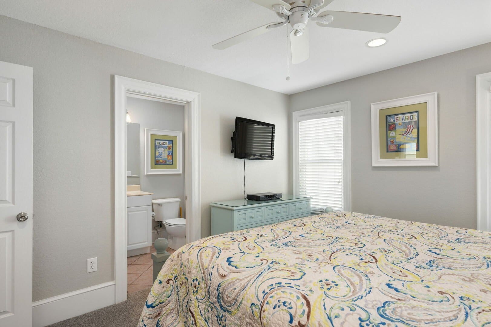 Bedroom with bathroom and TV.
