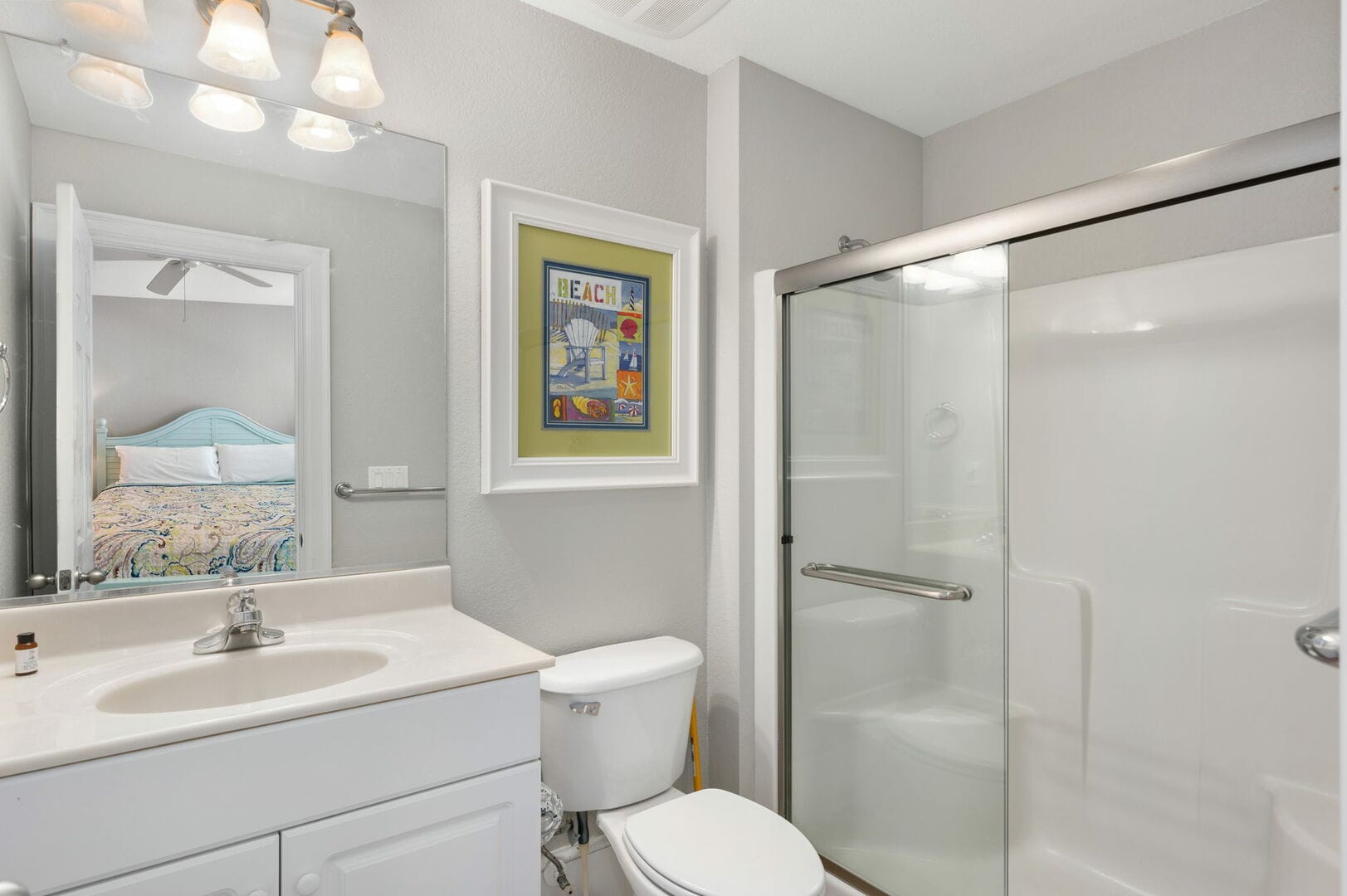 Bathroom with shower and mirror.