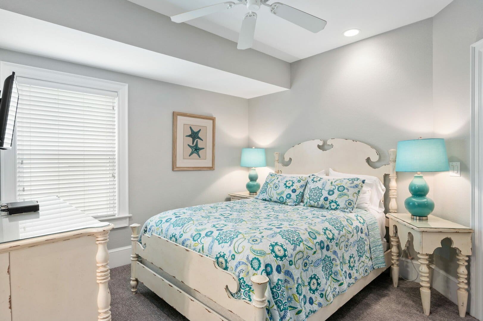 Cozy bedroom with patterned bedding.