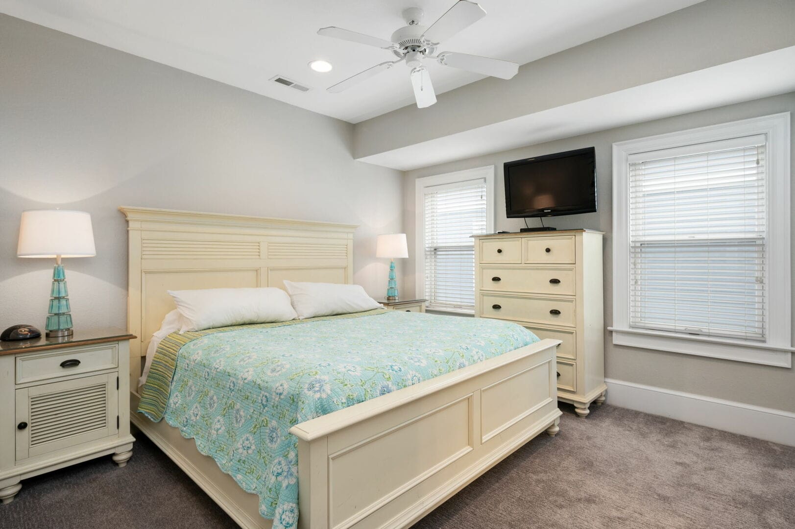 Bedroom with bed and dresser.