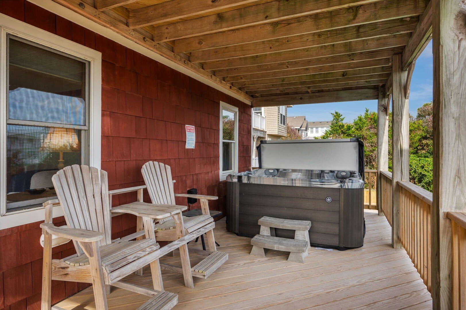 Deck chairs and hot tub outdoors.