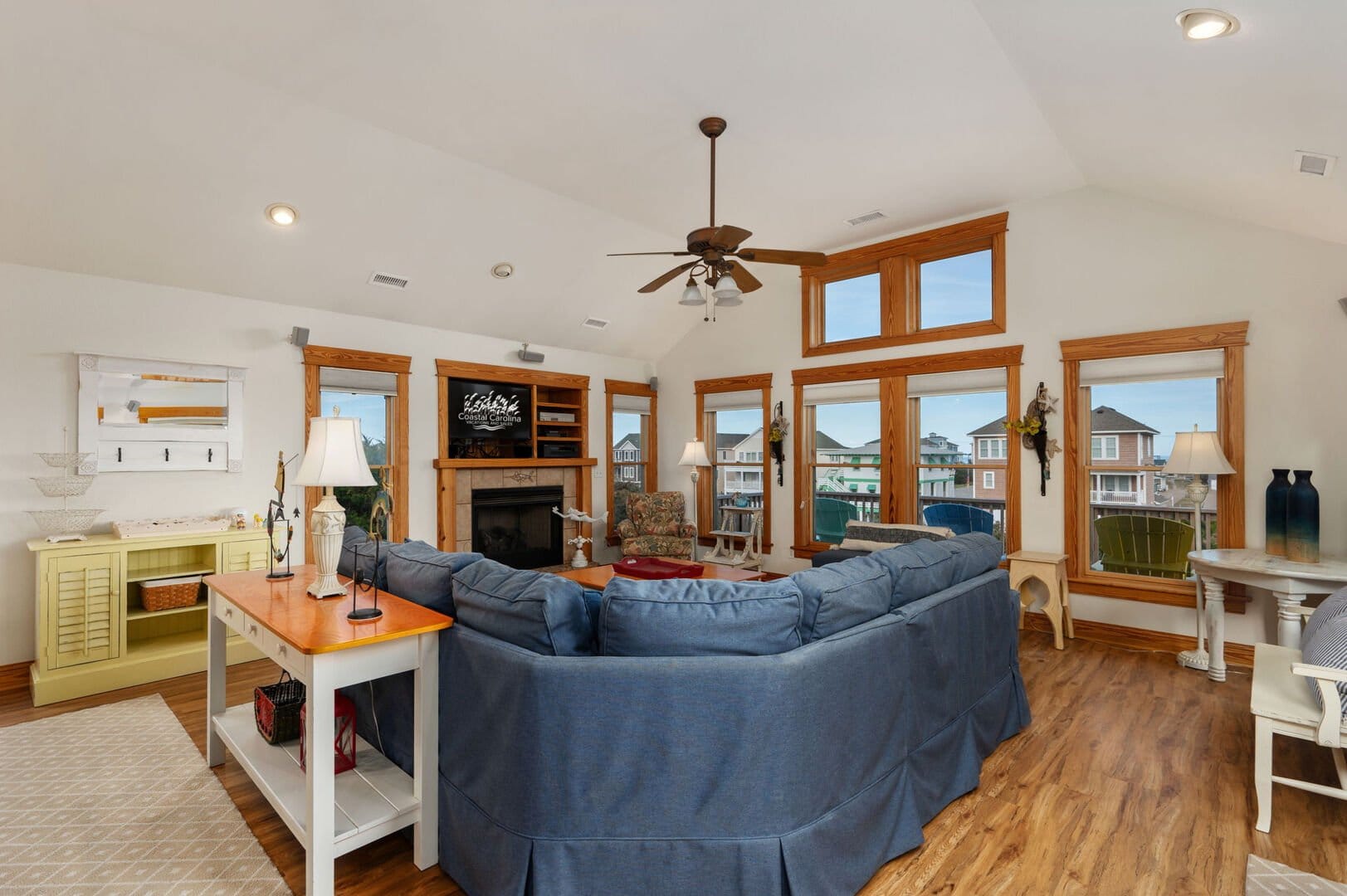 Spacious living room with blue sofa.