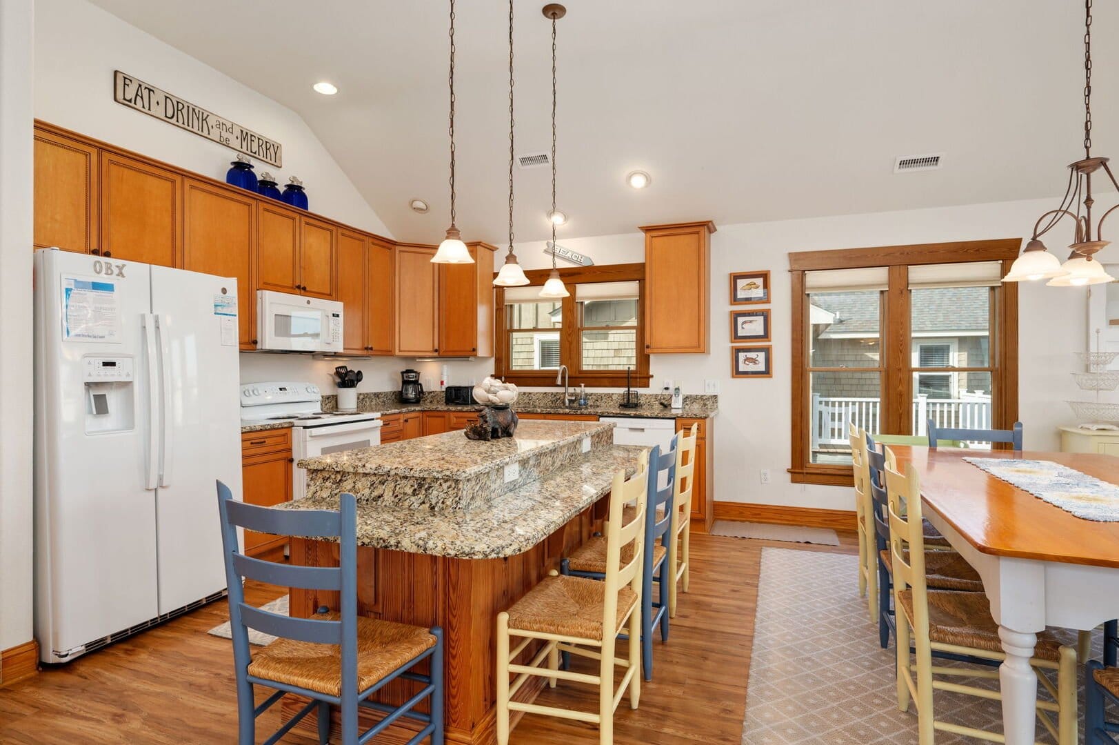 Kitchen with island and dining table.