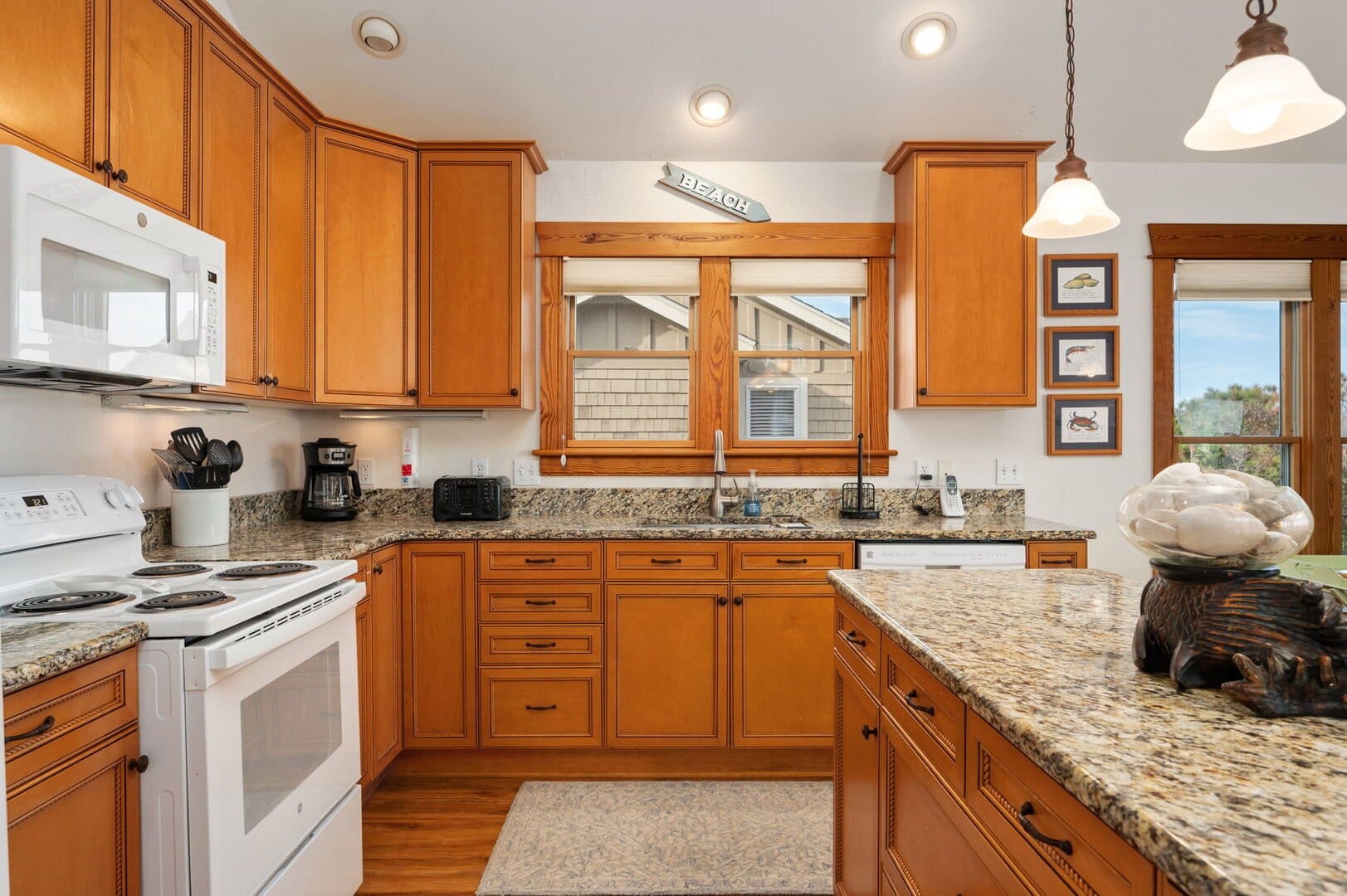 Wooden kitchen with granite countertops.