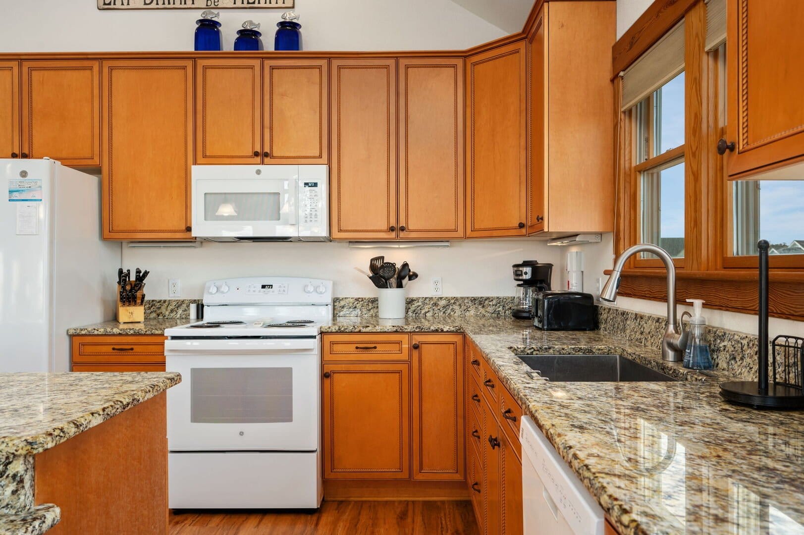 Bright kitchen with wooden cabinets.