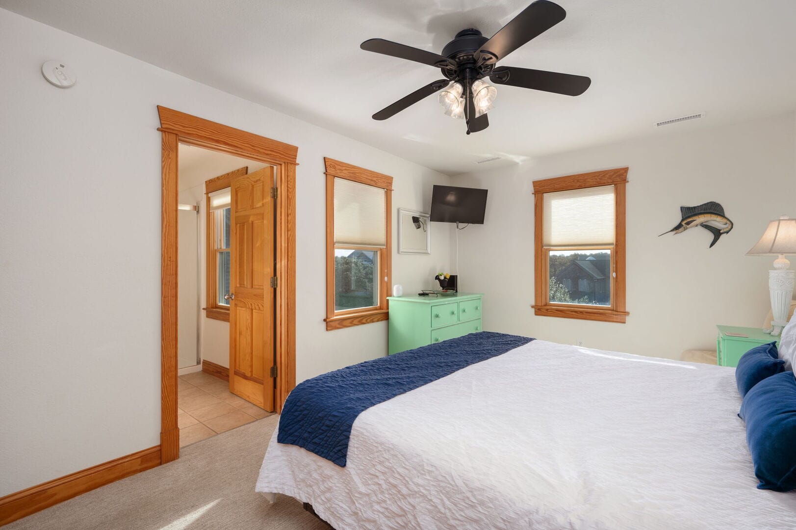 Bedroom with bed and dresser.