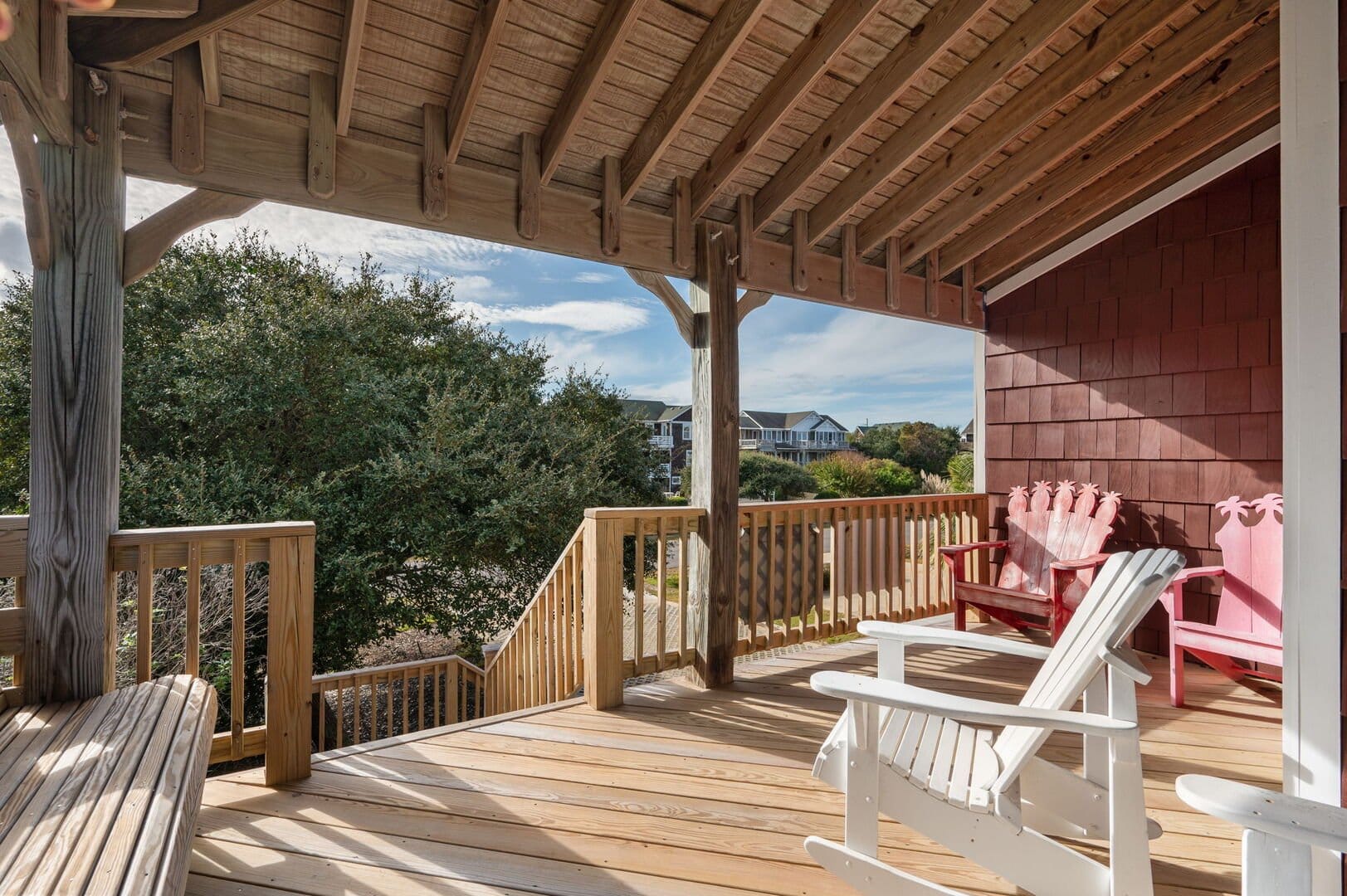 Wooden deck with chairs, view.