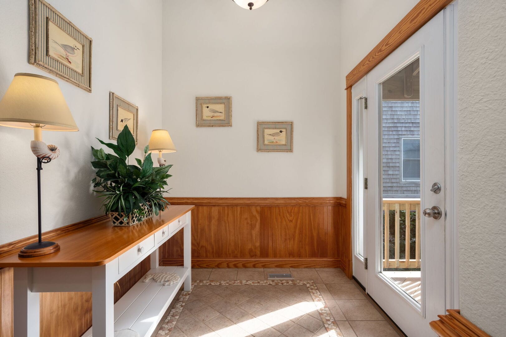 Hallway with table and lamp.