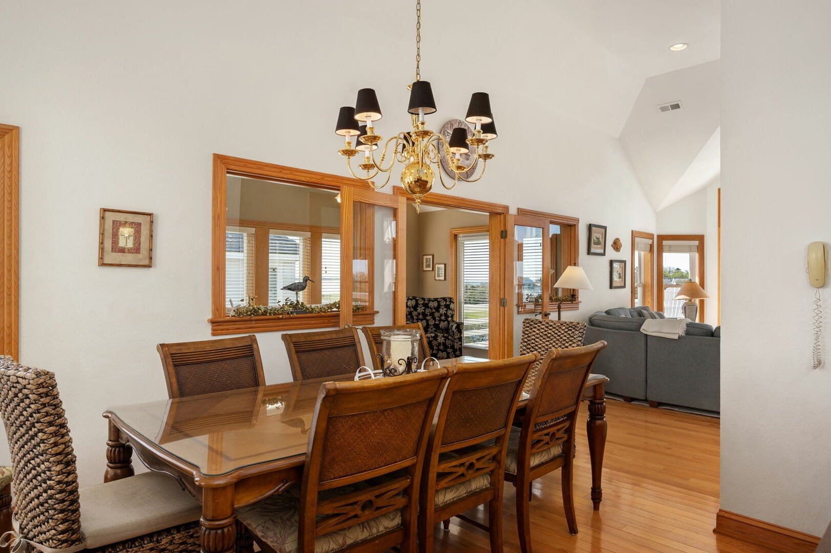 Dining room with chandelier, table.