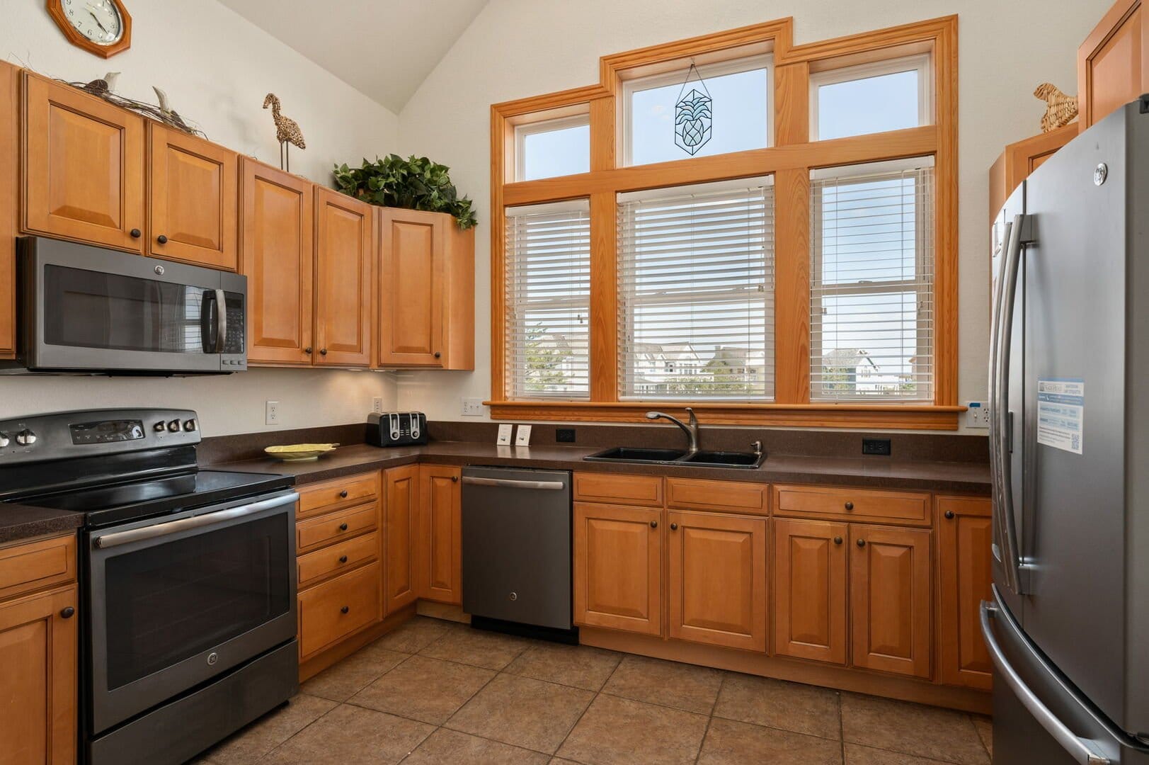 Wooden kitchen with modern appliances.