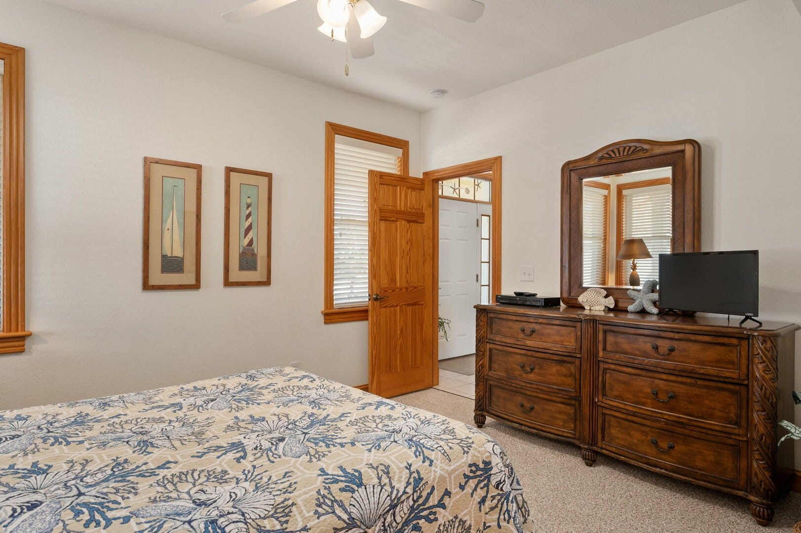 Cozy bedroom with wooden dresser.