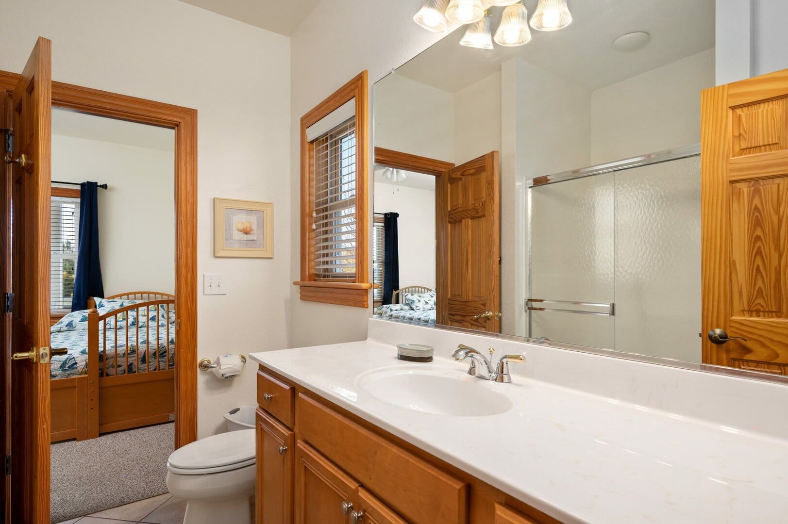 Bathroom and bedroom with wooden doors.