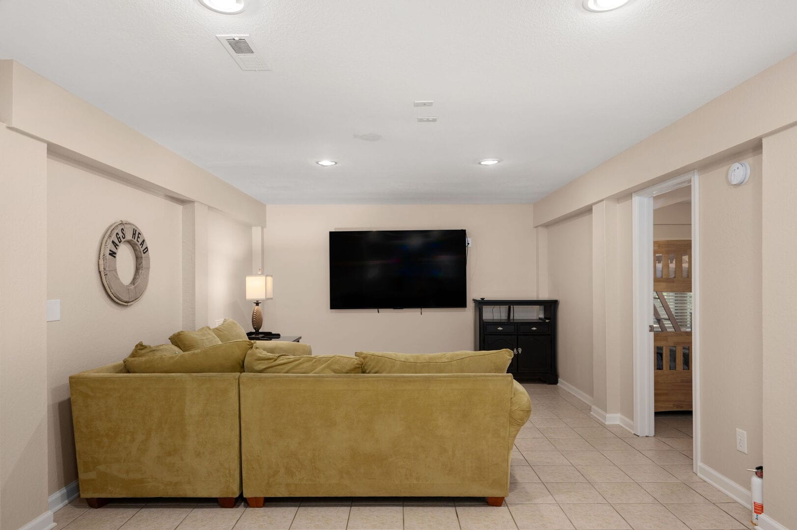 Living room with TV and sofa.
